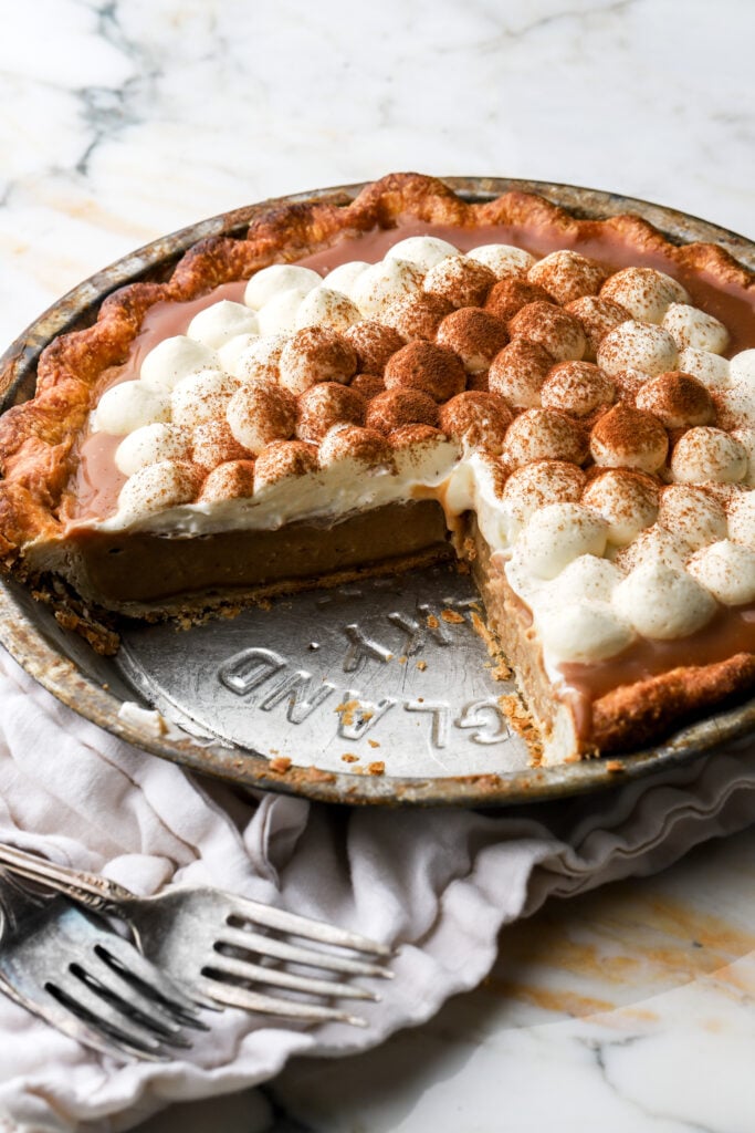 apple cream pie with slice cut pout
