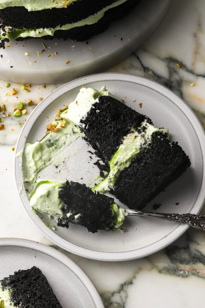 black cocoa cake frosted with pistachio cream