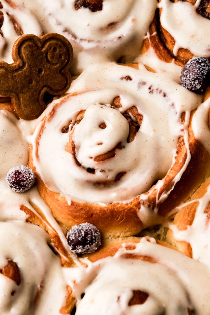 close up of cinnamon rolls with icing