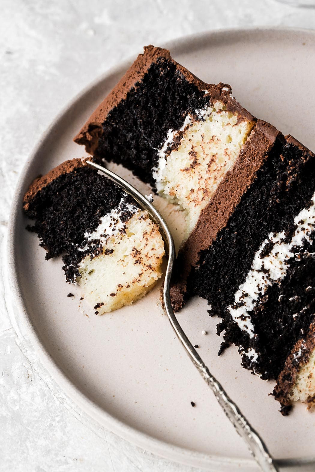 taking a bite of the tuxedo cake