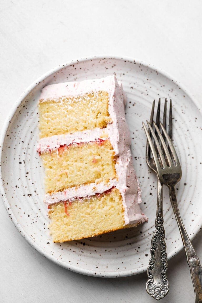 slice of a vanilla 6 inch cake with rhubarb frosting